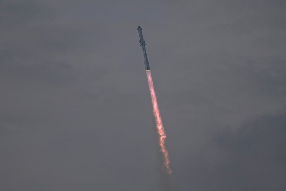 SpaceX's mega rocket Starship cuts through clouds and haze on it's third test flight from Starbase in Boca Chica, Texas, Thursday, March 14, 2024. (AP Photo/Eric Gay)