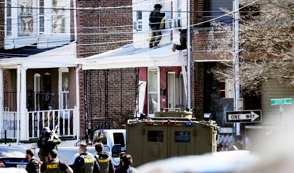 Police surround the suspect's home in Trenton, N.J., Saturday, March 16, 2024. (AP)