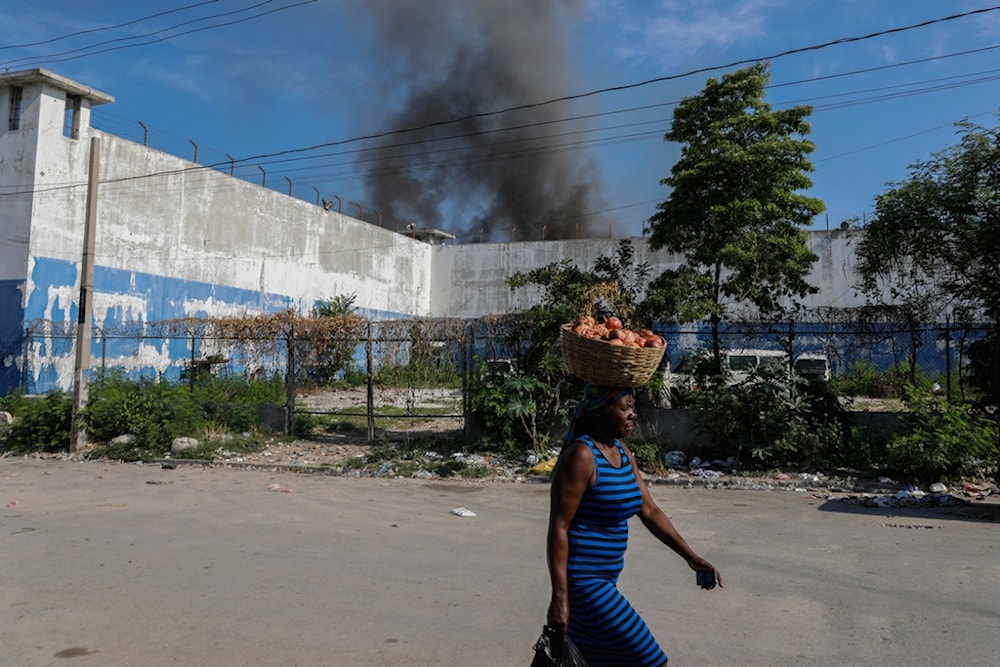National Police stand guard outside the empty National Penitentiary after a small fire inside in downtown Port-au-Prince, Haiti, Haiti, Thursday, March 14, 2024. (AP)