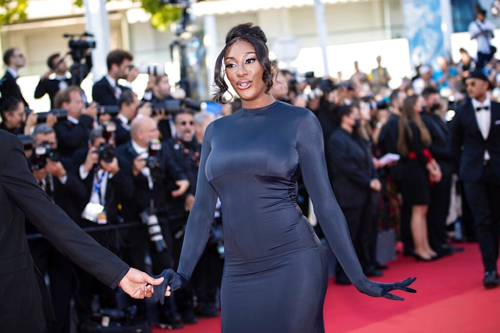 Aya Nakamura poses for photographers upon arrival at the premiere of the film 'Armageddon Time' at the 75th international film festival, Cannes, southern France, Thursday, May 19, 2022. (AP)