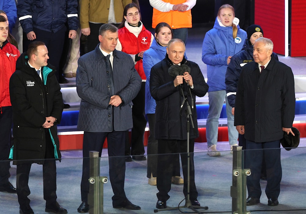 Russian President Vladimir Putin, 2nd right, attends a concert marking his victory in a presidential election in Moscow, Russia, Monday, March 18, 2024.(AP)