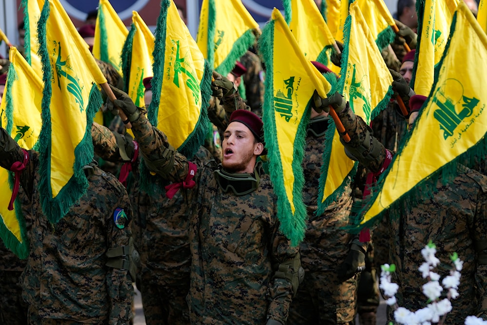 Hezbollah freedom fighters attend the funeral of their commander Wissam al-Tawil, in the village of Khirbet Selem, south Lebanon, Tuesday, Jan. 9, 2024. (AP)