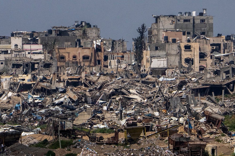 Destroyed buildings stand inside Gaza Strip, as seen from southern Israel, Tuesday, March 19, 2024. (AP)