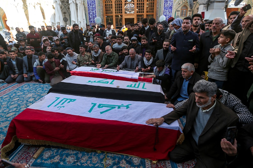 Iraqis attend the funeral of Popular Mobilization Forces fighters killed in the U.S. airstrikes at the Imam Ali shrine in Najaf, Iraq, Sunday, Feb. 4, 2024. (AP)