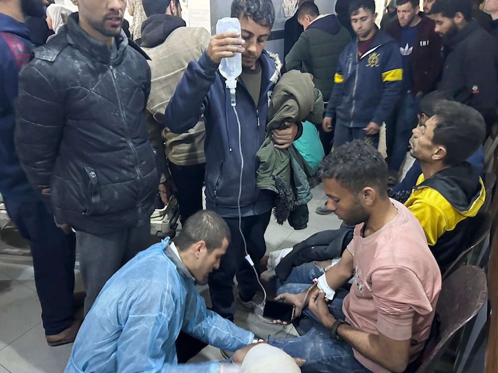 Palestinians wounded in an Israeli strike while waiting for humanitarian aid on the beach in Gaza City are treated in al-Shifa Hospital on Thursday, Feb. 29, 2024. (AP)