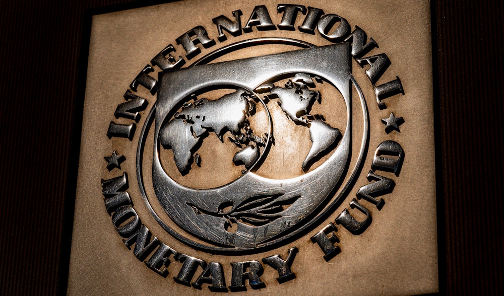 The logo of the International Monetary Fund is visible on its building, April 5, 2021, in Washington. (AP)