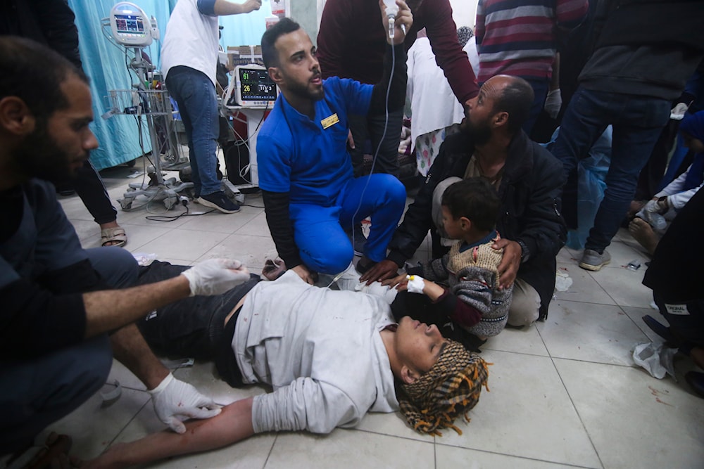 Palestinians wounded in an Israeli strike are treated in a hospital in Rafah, Gaza Strip, March 20, 2024 (AP)