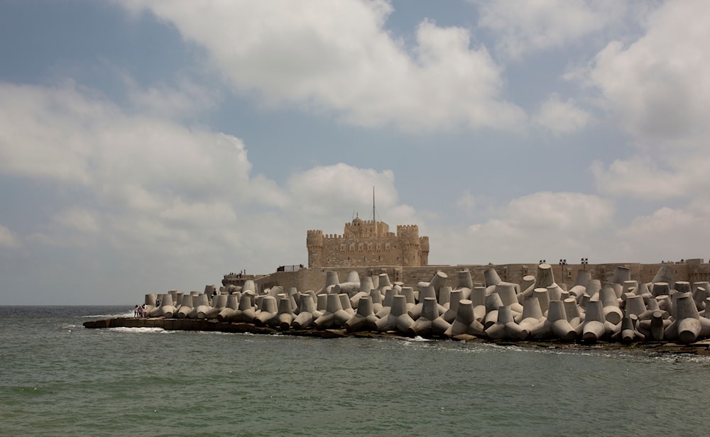 In this Aug. 8, 2019 photo, cement barriers reinforce the sea wall near the citadel in Alexandria, Egypt (AP Photo/Maya Alleruzzo)