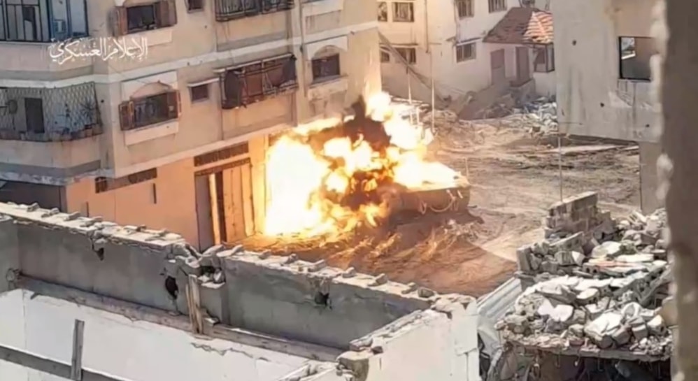 Al-Qassam Brigades destroy an Israeli occupation tank near the al-Shifa Medical Complex in Khan Younis on March 21, 2024. (Military media).png
