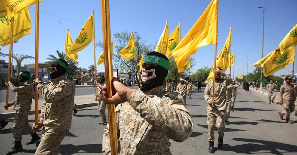 Iraqi al-Nujaba Resistance movement members march during a military parade marking Al-Quds International Day in Baghdad, May 31, 2019. (AFP)