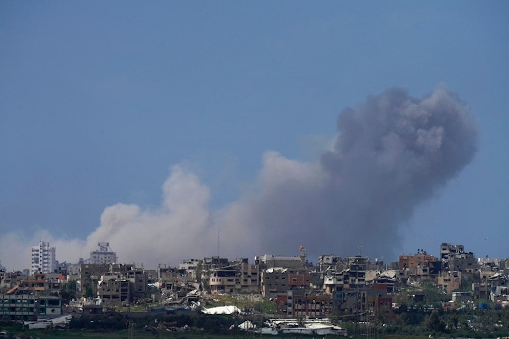 Smoke from Israeli bombardment of the northern Gaza Strip is seen from southern Palestine, Friday, March 22, 2024. (AP Photo/Tsafrir Abayov)