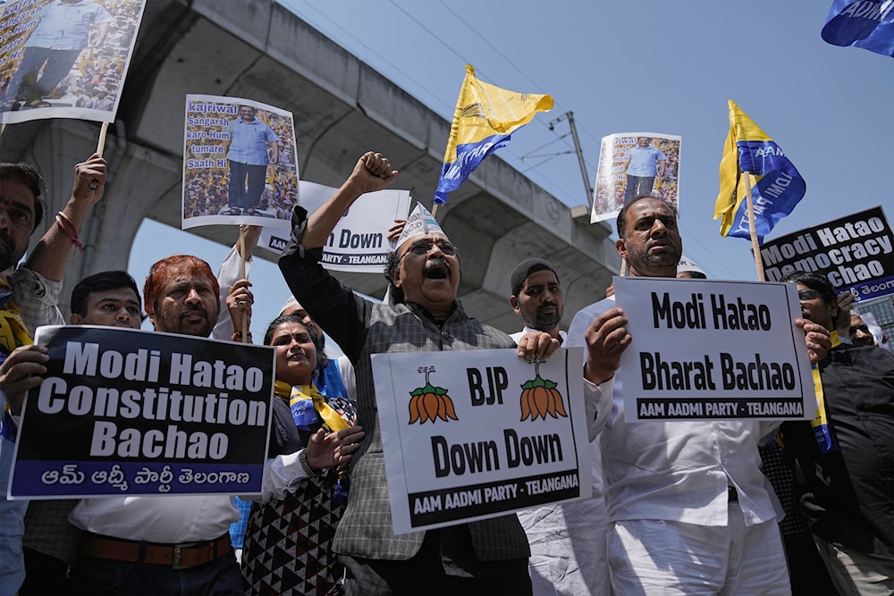 Supporters of Aam Admi Party, hold placards and shout slogans during a protest against the arrest of their party leader Arvind Kejriwal, in Hyderabad, India, Friday, March 22, 2024.(AP)