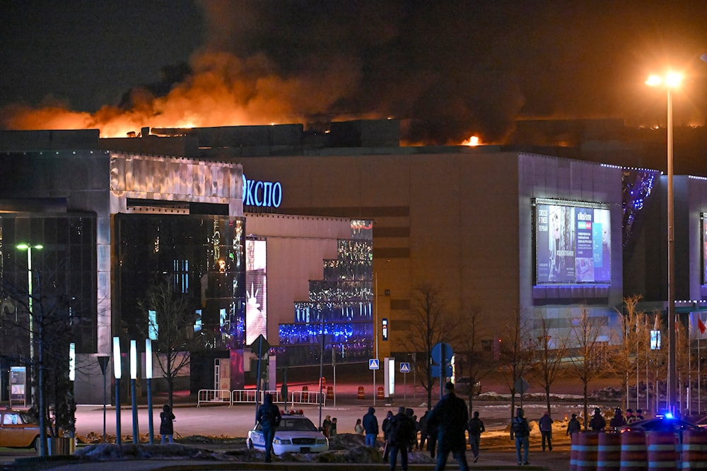 A massive blaze is seen over the Crocus City Hall on the western edge of Moscow, Russia, March 22, 2024 (AP)
