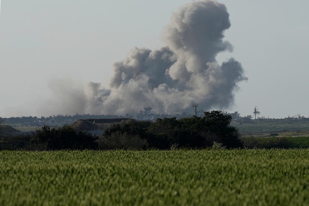 Smoke from Israeli bombardment of the Gaza Strip is seen from southern occupied Palestine, March 22, 2024 (AP)