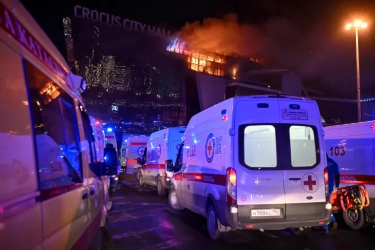 Ambulances wait to carry the injured to hospital following the attack on the concert venue in the Moscow suburbs (AP)