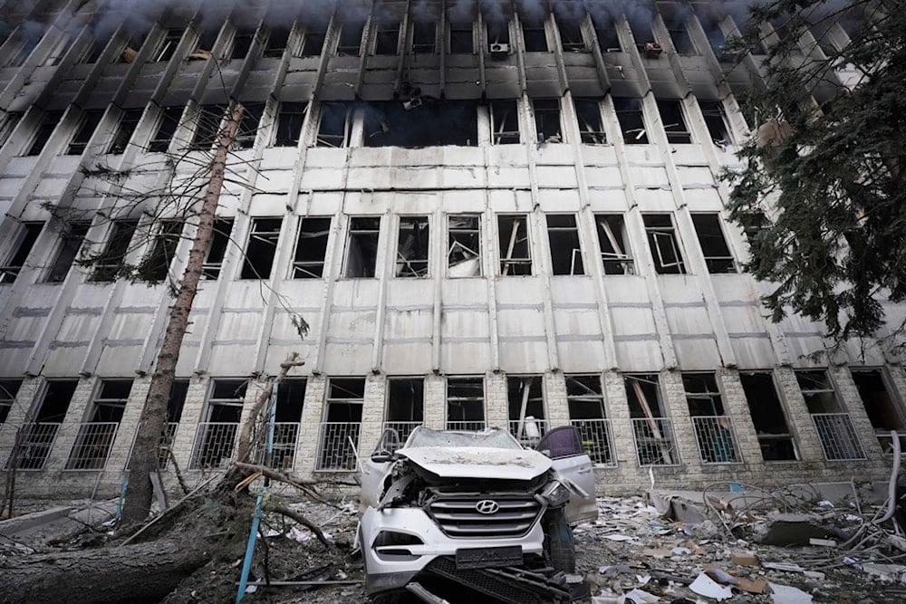 A damaged car is seen in at the site of a Russian attack in Kharkiv, Ukraine, Wednesday, March 20, 2024. (AP Photo/Andrii Marienko)