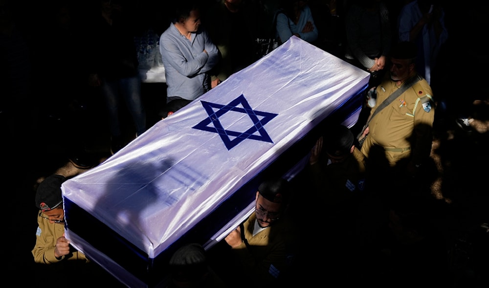Israeli occupation soldiers carry the casket of a Sergeant during his funeral in occupied Palestine, Monday, Feb. 26, 2024 (AP)