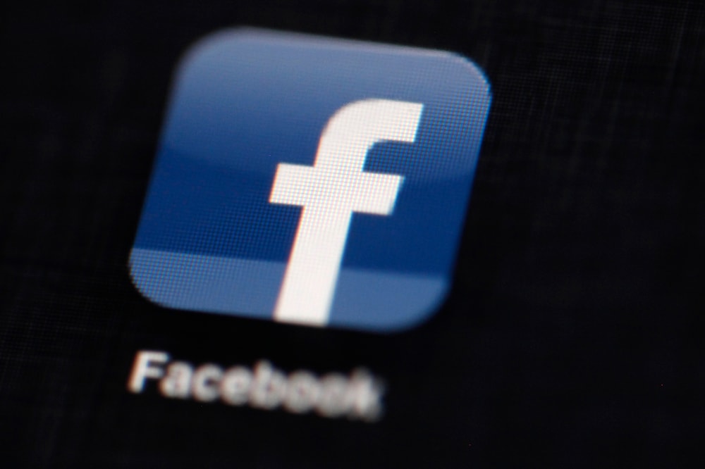 file photo shows the Facebook logo displayed on an iPad in Philadelphia on March 16, 2012. (AP)