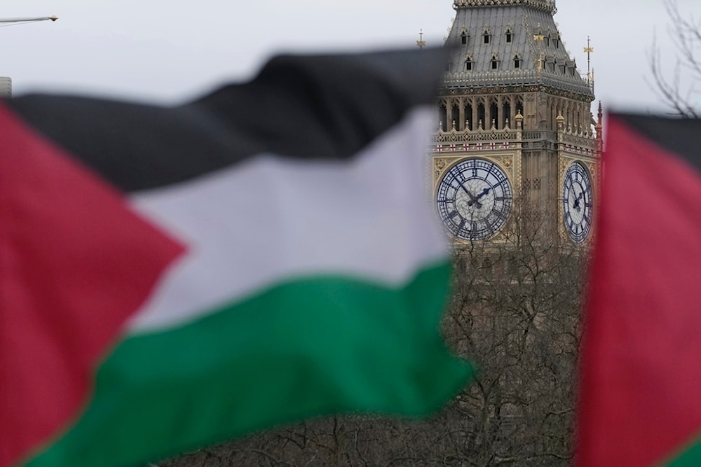 Pro-Palestinian protesters hold up flags during a demonstration in London, Saturday, Feb. 3, 2024 as they demand for a full cease fire and an end to the siege of Gaza. (AP)