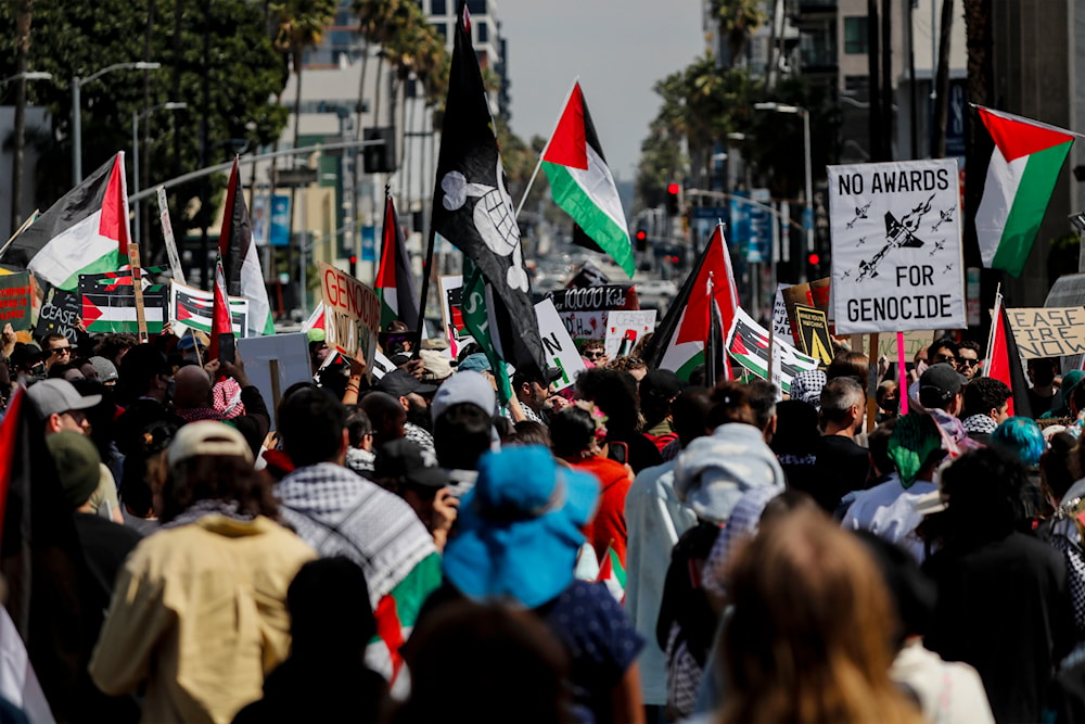 Protesters gather during a demonstration in support of Palestinians calling for a ceasefire in Gaza as the 96th Academy Awards Oscars ceremony is held nearby, Sunday, March 10, 2024, in the Hollywood section of Los Angeles. (AP)