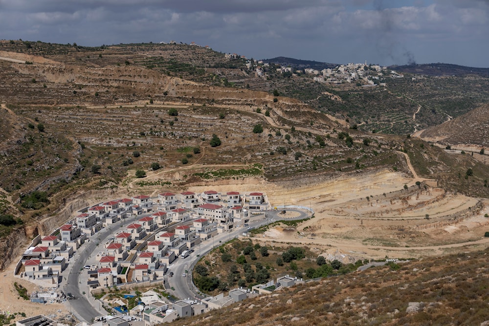 New housing projects are seen in the West Bank Israeli settlement of 'Givat Ze'ev', June 18, 2023 (AP)