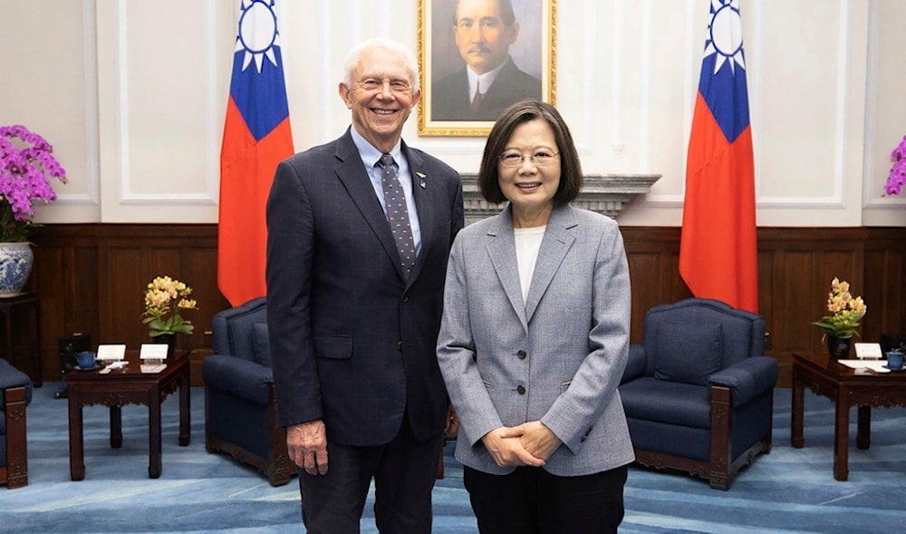 Taiwan's President Tsai Ing-wen, right, poses for photos with Rep. Jack Bergman, R-Mich., in Taipei, Taiwan on Thursday, March 28, 2024 (AP)