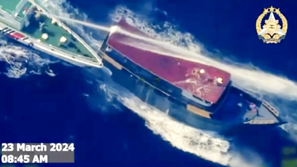 Screenshot from video provided by the Philippines Armed Forces, a Chinese coast guards uses water cannons and maneuver near a Philippine resupply vessel in the South China Sea on March 23, 2024. (AP)