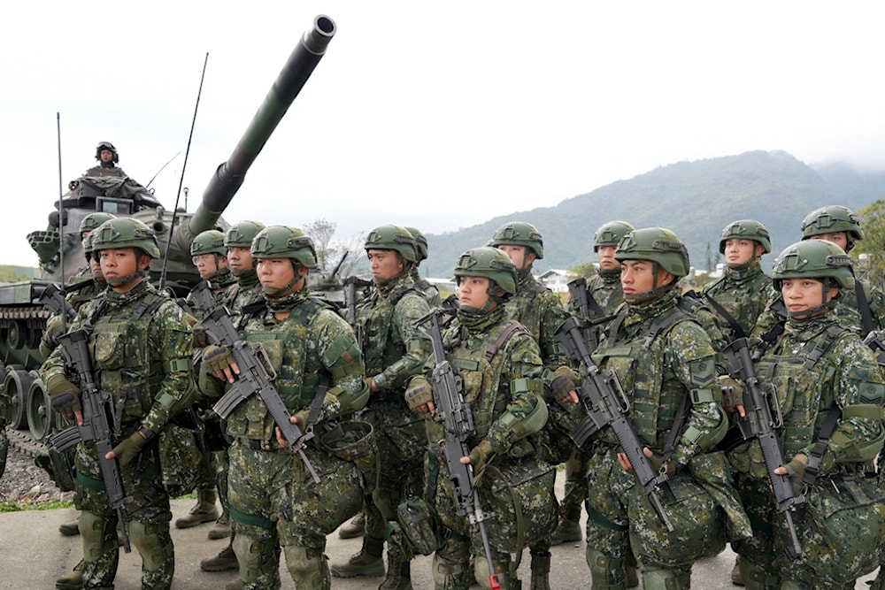 Taiwanese soldiers take part in drills at the Army defense command base in Taitung in southern Taiwan on Wednesday, Jan. 31, 2024. (AP)