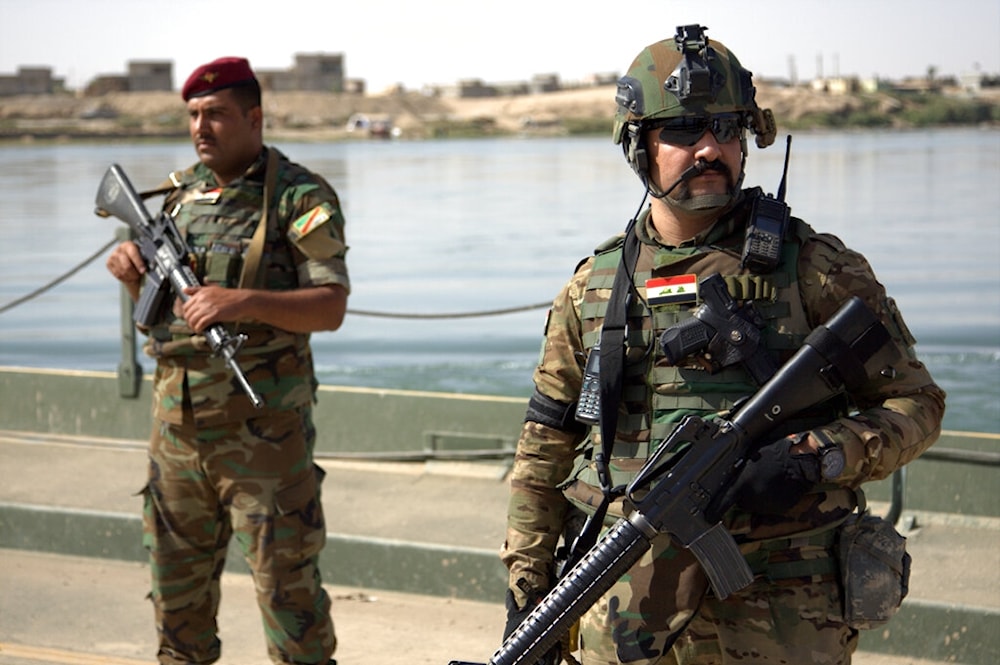 n this Saturday, Oct. 15, 2016 file photo, Iraqi soldiers secure a temporary pontoon bridge near Qayara Air Base, northern Iraq (AP)