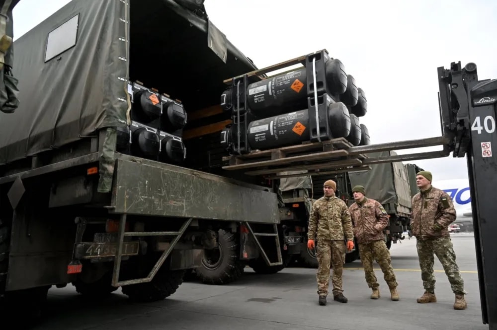Ukrainian soldiers load a truck with a US-made FGM-148 Javelin anti-tank missile on its delivery at Kiev's Boryspil Airport on Feb. 11. (AFP via  Getty Images)