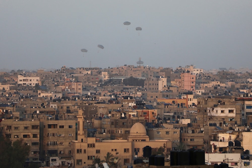 Humanitarian aid is dropped by the United States over Gaza City, Gaza Strip, on Saturday, March 2, 2024. (AP Photo/Mohammed Hajjar)