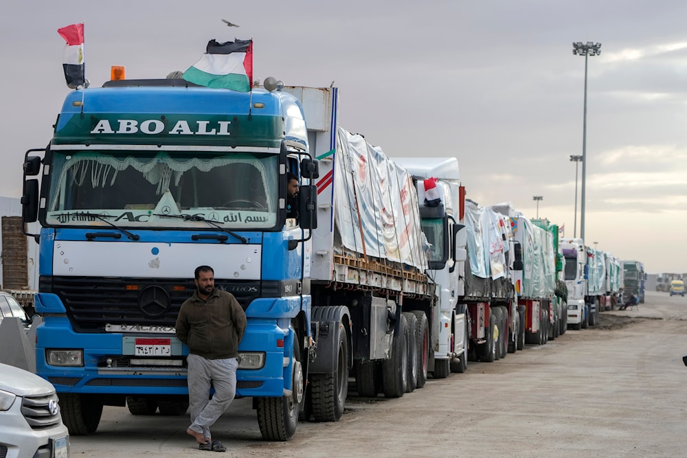 Trucks carrying humanitarian aid line up at the Rafah Border Crossing, Egypt, on the way to Gaza, Sunday, Nov. 19, 2023. (AP)