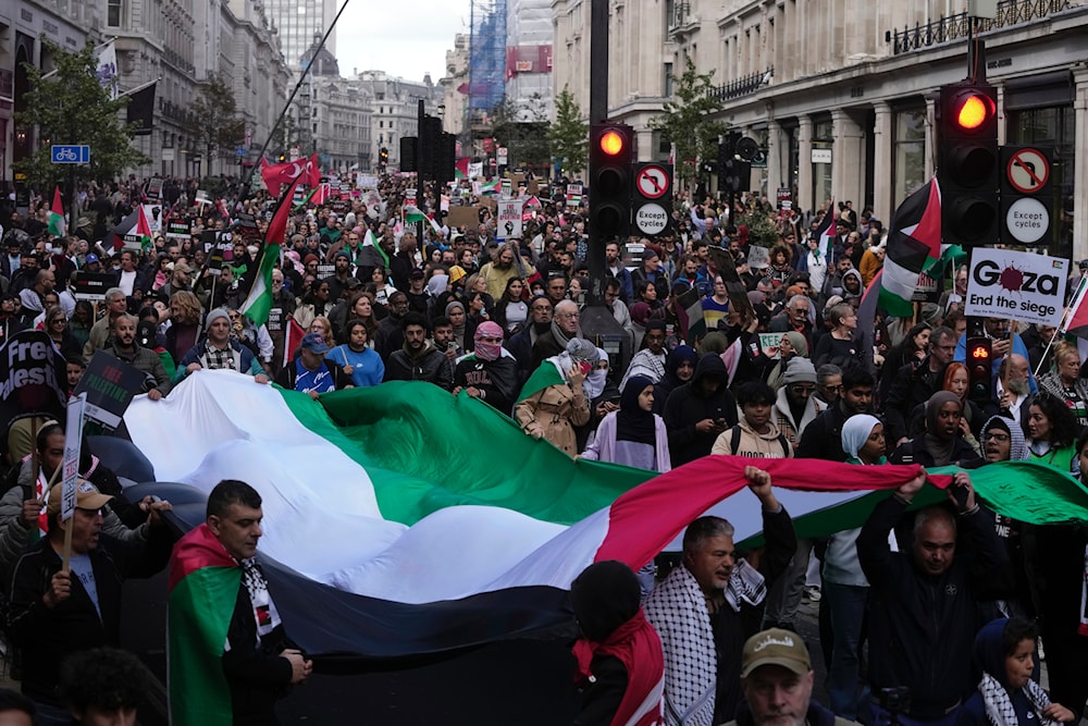 Protesters march during a pro-Palestinian demonstration in London, Saturday, Oct. 14, 2023.(AP)