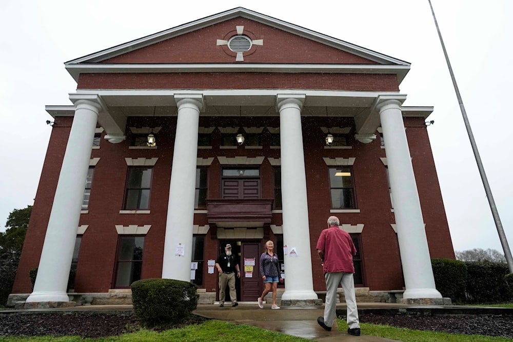 Voters enter and exit a polling facility at the Seale Courthouse in Russell County during a primary election, Tuesday, March 5, 2024, in Seale, Alabama (AP)