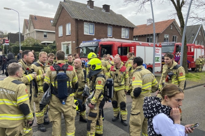 Firefighters gather in Eden, Netherlands, Saturday, March 30, 2024. Heavily armed police have cordoned off part of a Dutch town and say that multiple people are being held hostage in a building there. (AP)