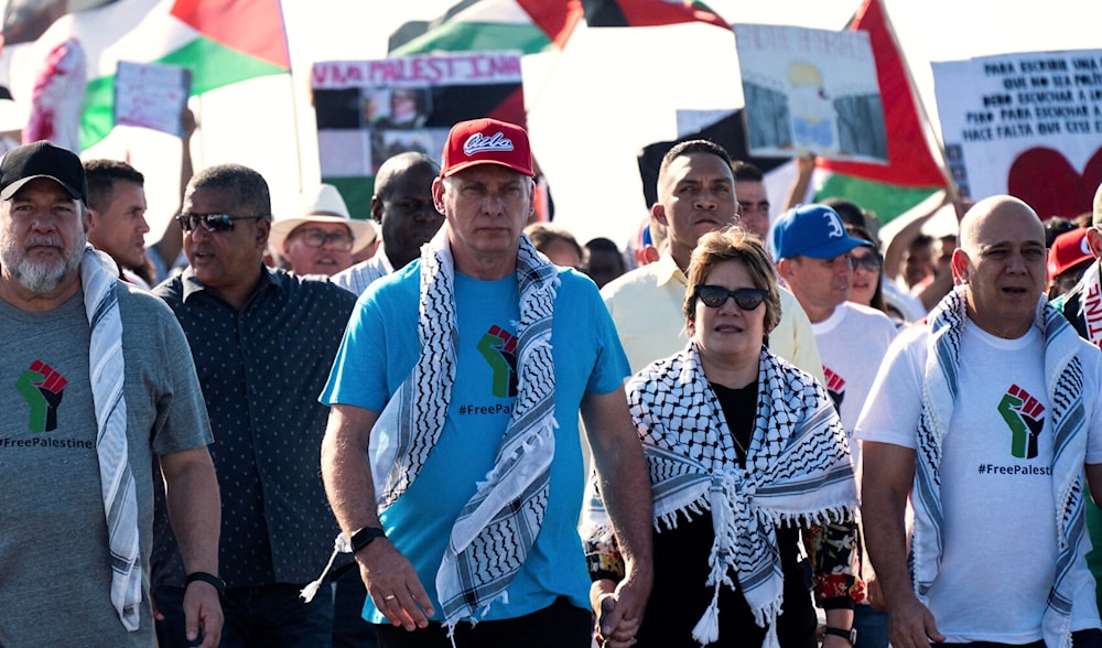 Cuba's Prime Minister Manuel Marrero, Cuba's President Miguel Diaz-Canel, and his wife Lis Cuesta take part in a march in support of the Palestinian people in Havana, Cuba on November 23, 2023 (AP)