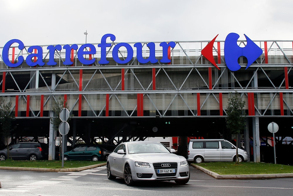 Car leaves a Carrefour supermarket in Anglet, southwestern France, on Jan.23, 2018.(AP)