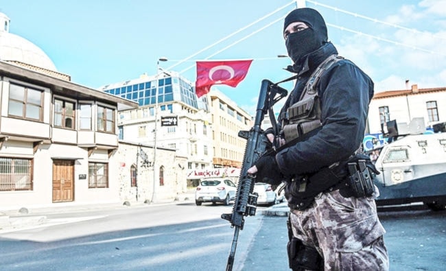 A Turkish special force police officer stands guard at ortakoy, in Istanbul, Turkey. (AFP)