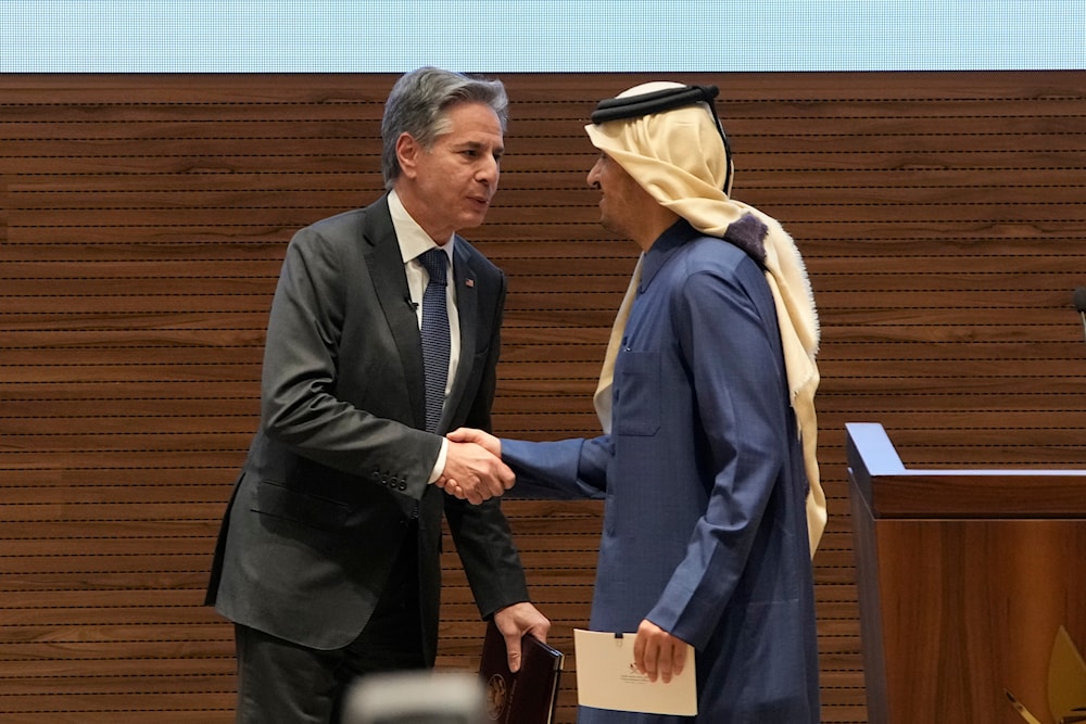 US Secretary of State Antony Blinken and Qatar's Prime Minister and Foreign Affairs Minister Mohammed Bin Abdulrahman Al Thani shake hands after their joint press conference at Diwan Annex, in Doha, Qatar, Tuesday, Feb. 6, 2024. (AP)