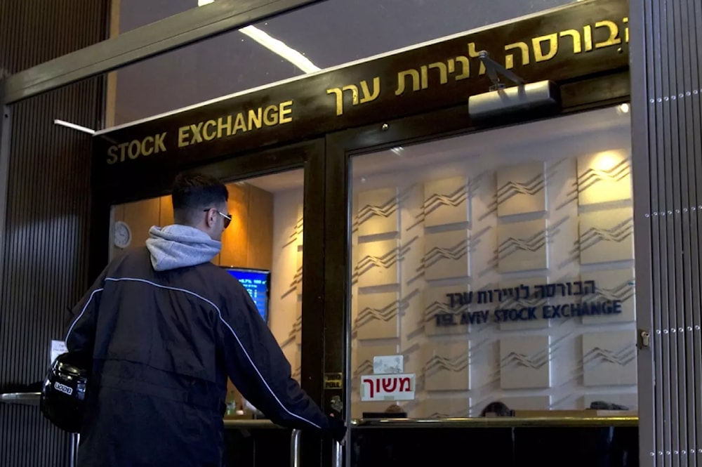 A man is seen at the Tel Aviv Stock Exchange in 