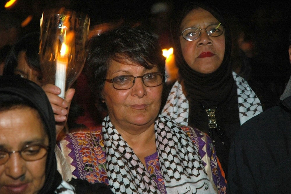 Leila Khaled, pictured on 28 July 2006 marches through the streets of Cape Town city centre, South Africa (AFP)