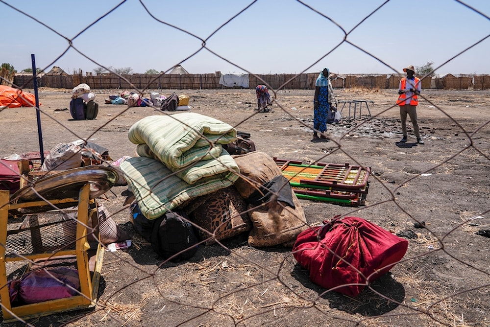 The belongings of people who crossed the border from Sudan sit in a yard at the Joda border crossing in South Sudan Tuesday, May 16, 2023 (AP)