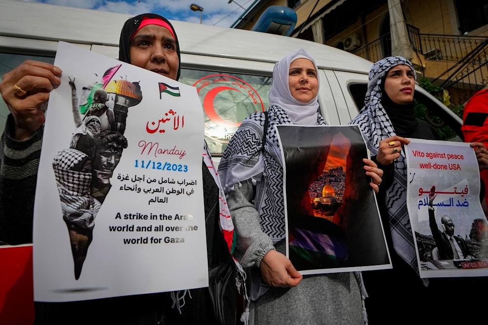 Palestinian women at a rally by pro-Palestinian activists to demand a ceasefire in Gaza, at Bourj al-Barajneh Palestinian refugee camp in Beirut, Lebanon, Dec. 11, 2023. (AP)