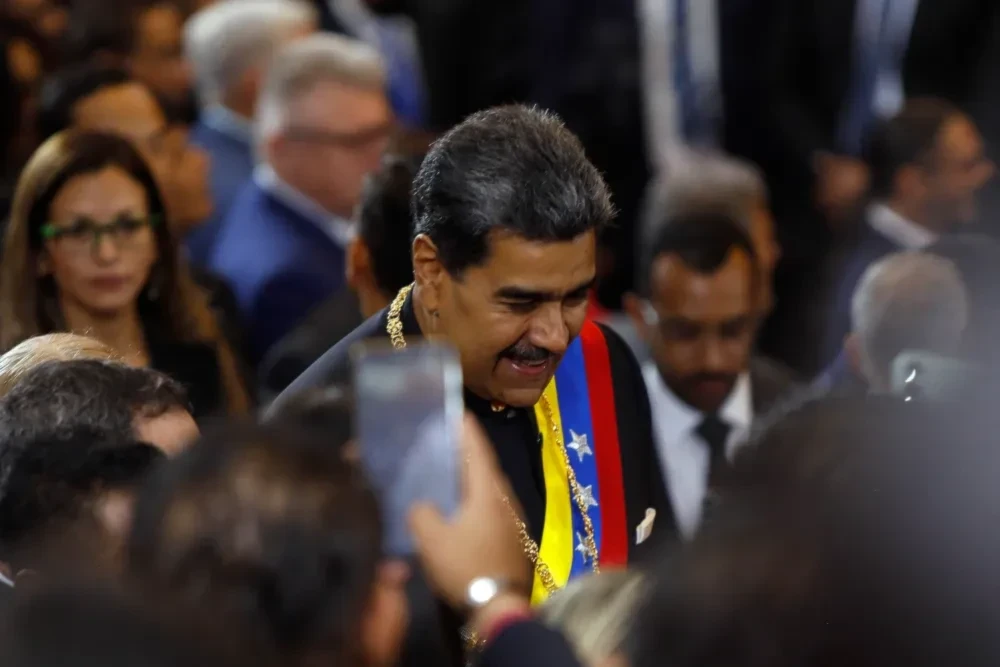 Venezuelan President Nicolas Maduro greets attendees upon his arrival at the Supreme Court of Justice building for the inauguration ceremony of the judicial year in Caracas on Jan. 31. (AFP via Getty Images)