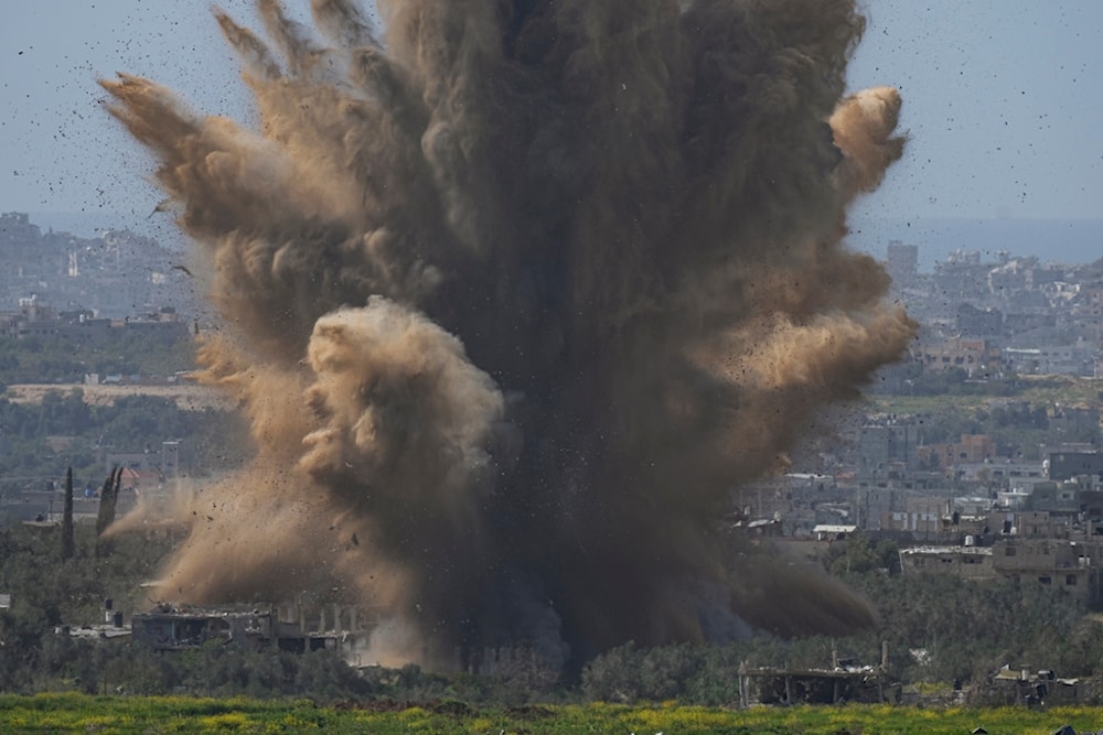 Smoke and debris rise following an explosion in the Gaza Strip as seen from southern Palestine, Wednesday, March 6, 2024. (AP Photo/Ohad Zwigenberg)