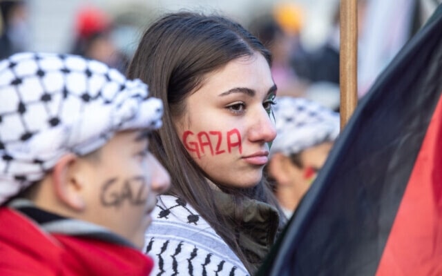 Illustrative: Demonstrators in support of Palestinians wear Gaza' painted on their faces during a rally to call for a ceasefire in Gaza, at Dorchester Square in Montreal, Quebec, Canada, on November 18, 2023. (AFP)