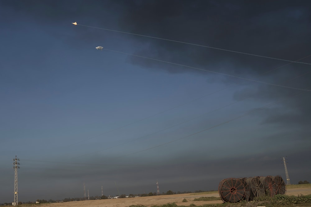 Israeli Iron Dome air defense system fires to intercept rockets fired from the Gaza Strip, in southern occupied Palestine, January 21, 2024 (AP)