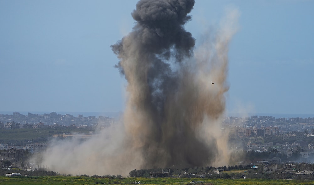 Smoke rises to the sky following an explosion in Gaza on March 6, 2024 (AP)
