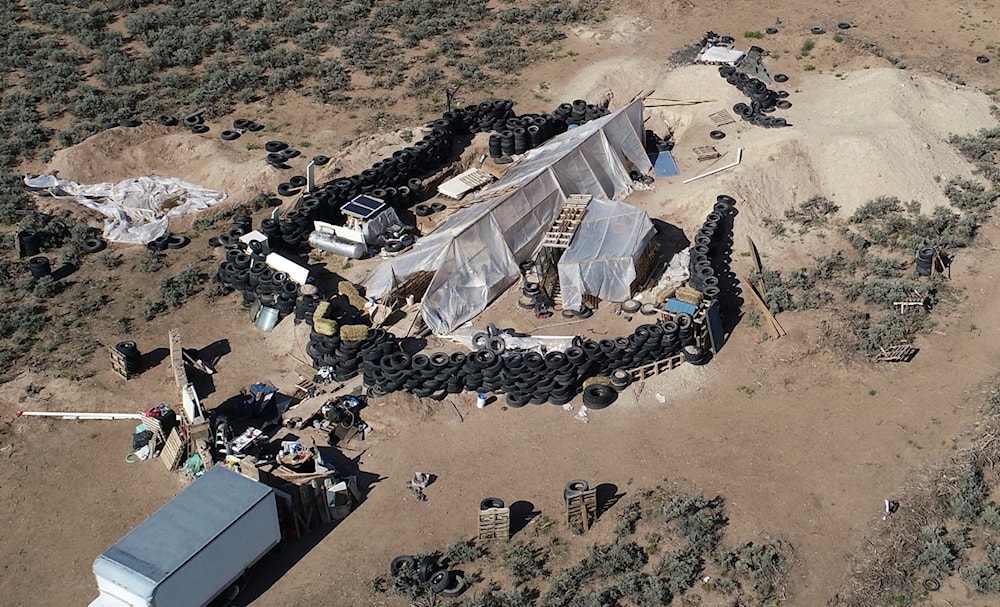 A ramshackle compound is seen in the desert area of Amalia, N.M., on Aug. 10, 2018 (AP)