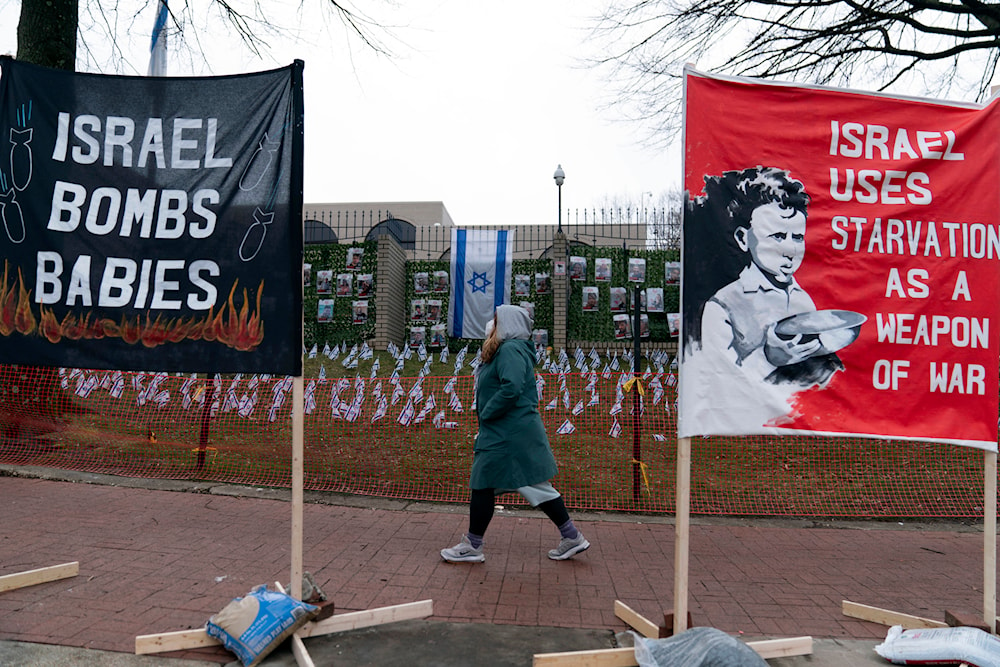 Banners are seen during a pro-Palestinian demonstration outside of the Israeli Embassy in Washington, Saturday, March 2, 2024. (AP)
